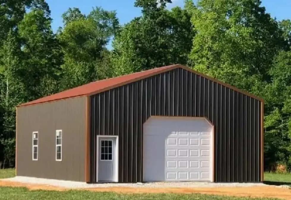 Brown metal garage with a white roll-up door