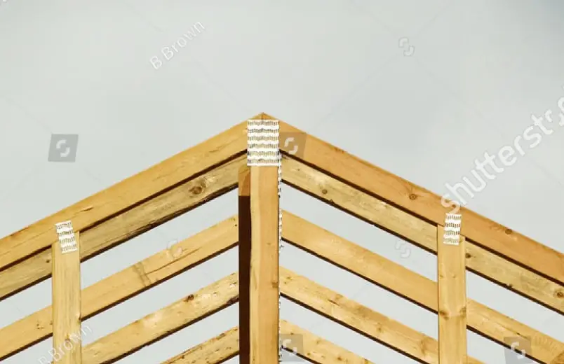 Wood roof truss peak with metal connector plates