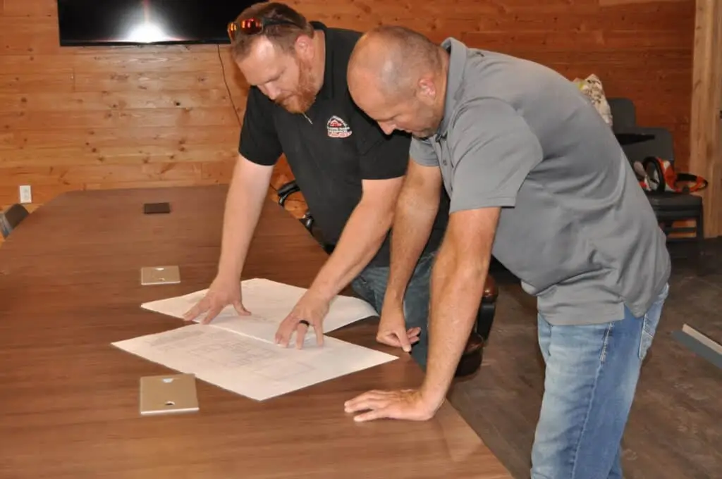 Quality Building Supply team going over plans