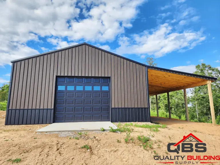 Brown metal garage with a dark roll-up door and lean-to