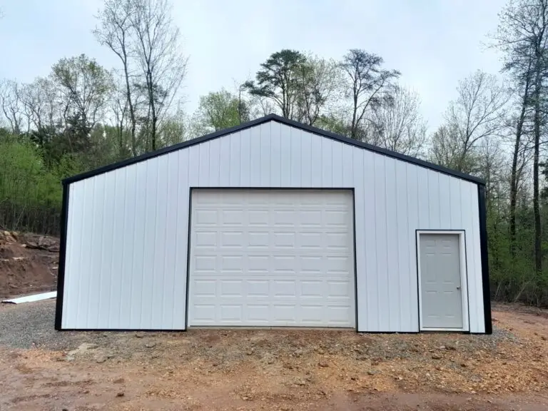 Front of the 30 x 40 x 12 garage, white metal with a roll-up door