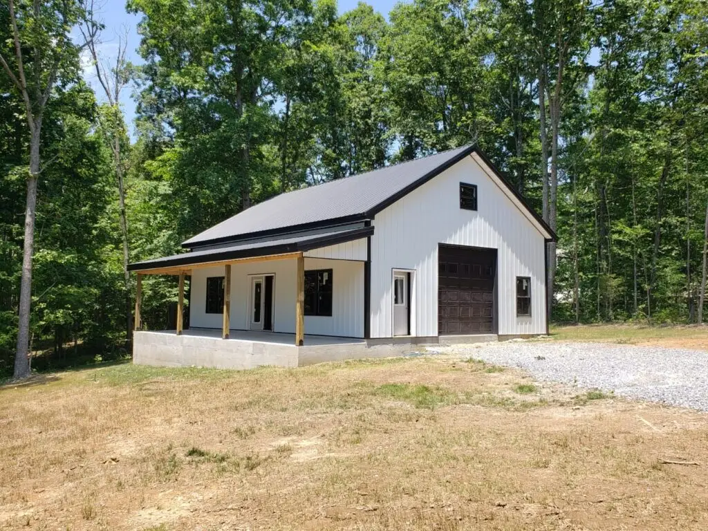 30 x 40 x 12 garage with side shed, white with a dark roof, garage door and side shed