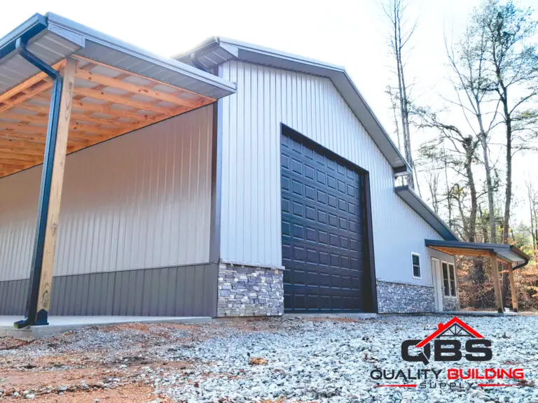 Dark roll-up door and stone wainscot on the 30 x 60 x 16 garage herbert