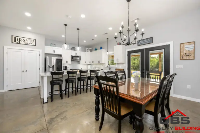 Smith barndominium kitchen and dining area with chandeliers