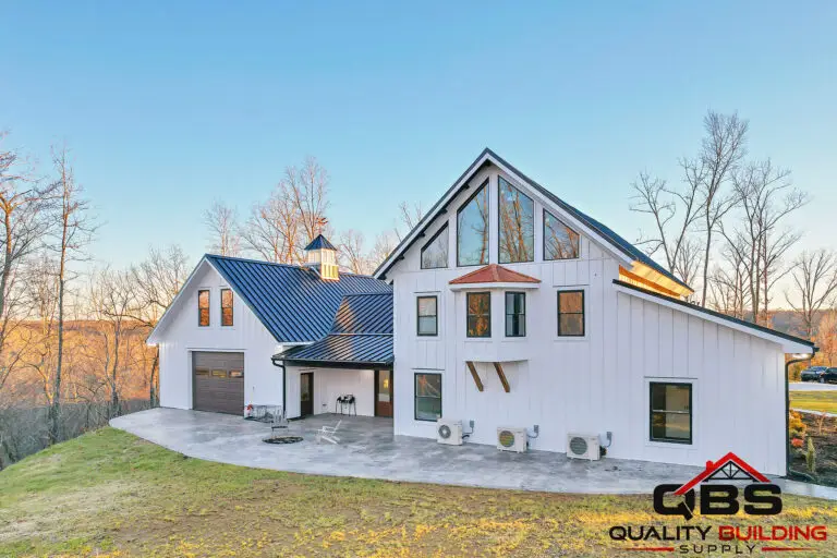 The South Fork Barndo, white board-and-batten with tall gable windows
