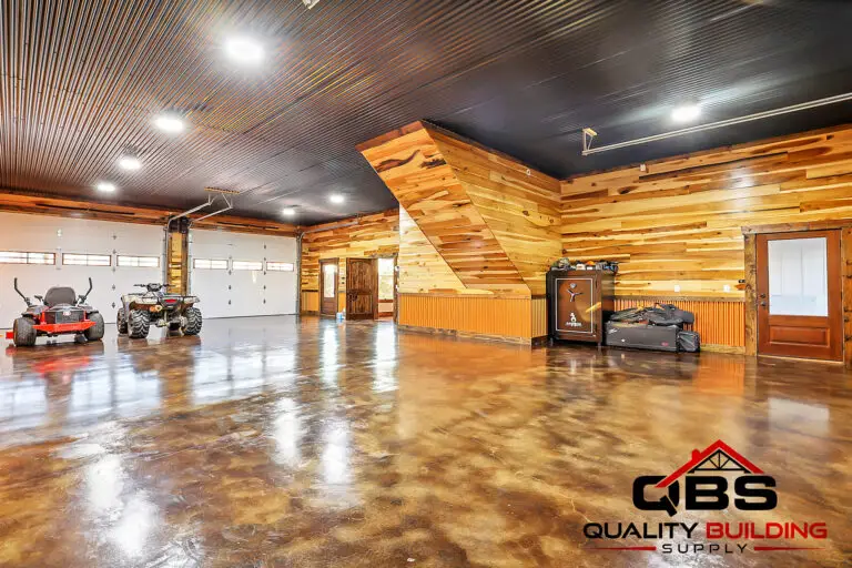 Shop with wood plank walls and an epoxy floor in the South Fork Barndo