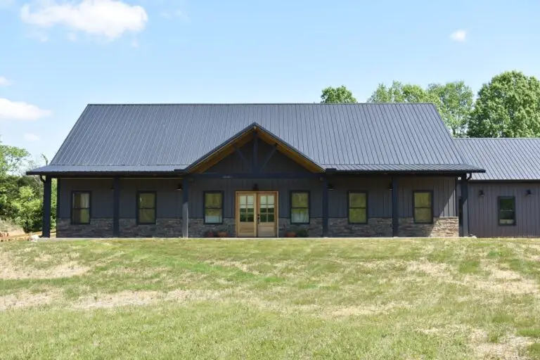 Tubberville Home, dark board-and-batten barndominium with timber gable