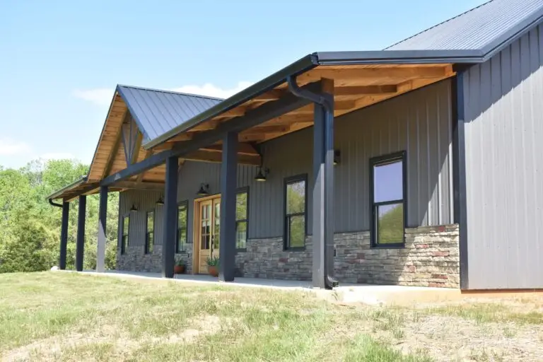 Tubberville Home covered porch with timber posts and stone