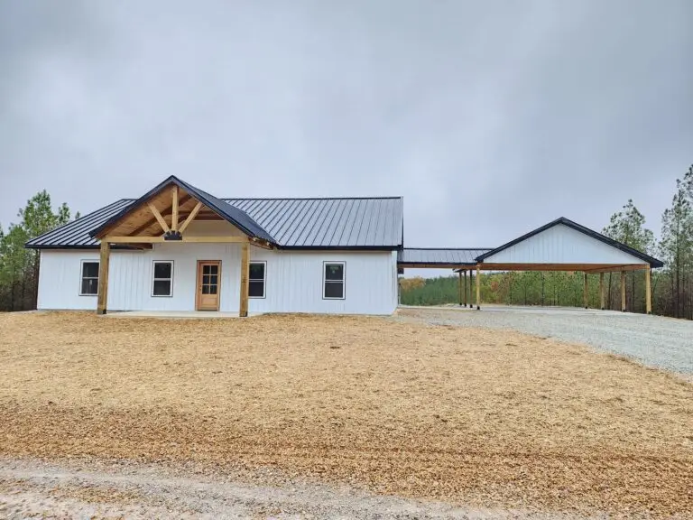 Viewpoint barndominium front with timber gable porch