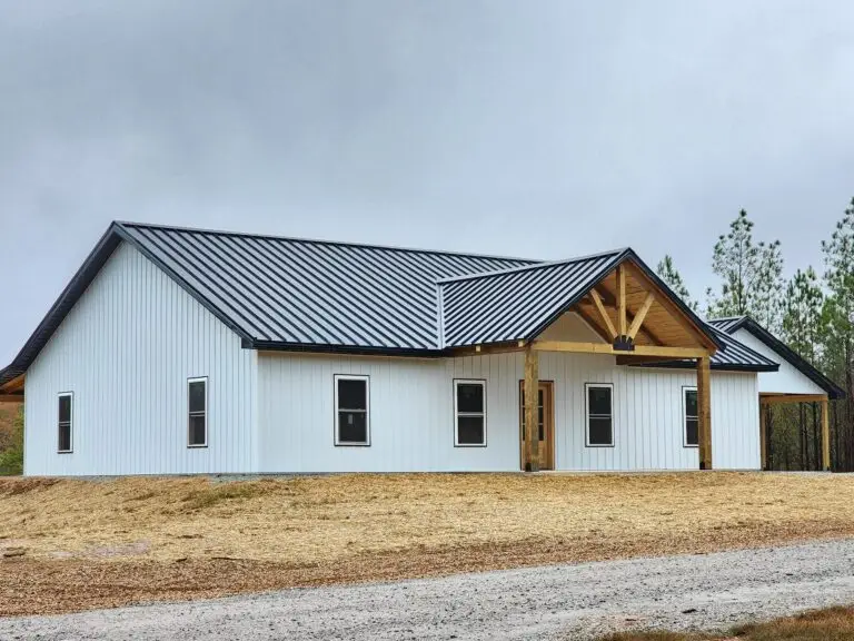 Viewpoint barndominium with metal roof and timber gable