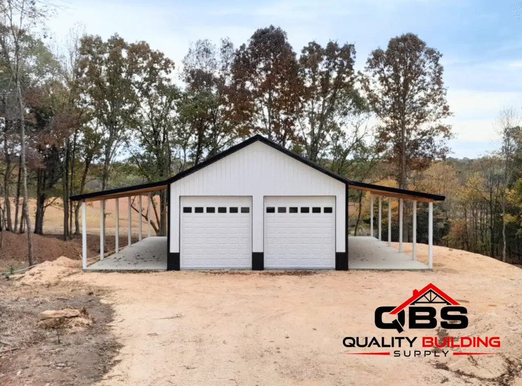 Front of the 30 x 50 x 12 garage with lean to, white with black wainscot