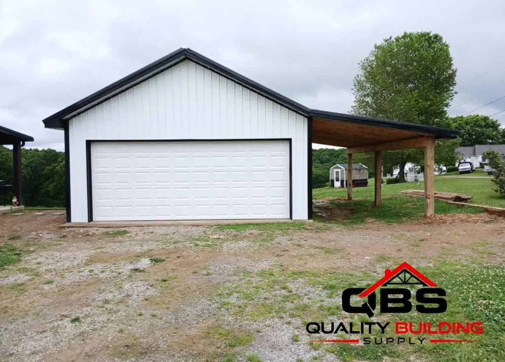 24 x 30 x 10 garage with 12 ft side shed with a white roll-up door and open side shed