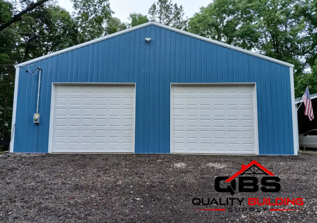 30 x 30 x 10 garage, blue metal with two white garage doors