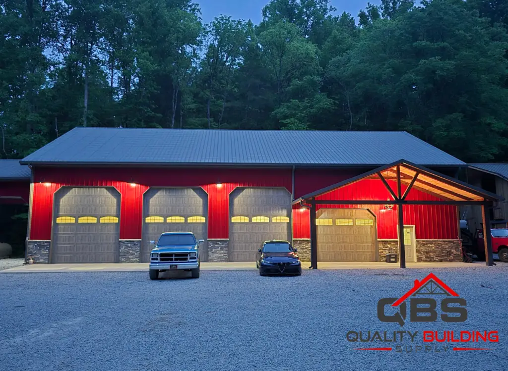 50 x 80 x 18 garage, gray and red shop with stone wainscot and lit garage doors