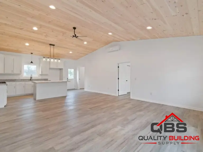 Open kitchen and living area with a wood ceiling in the Oak Hill Barndo