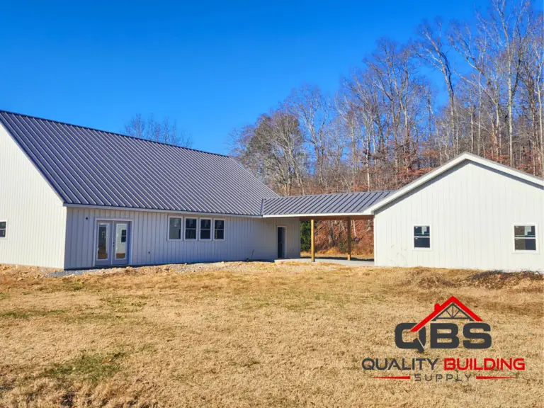 Side of the Richland Hollow barndominium, white with a gray metal roof