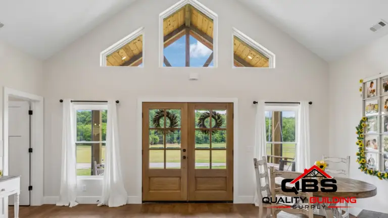 Great room with gable windows and French doors in the Cypress Ridge barndominium