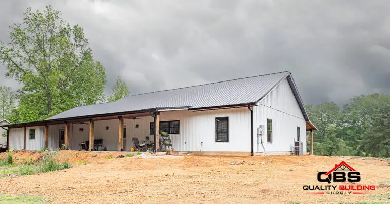 Side of the White Oak barndominium with a covered porch