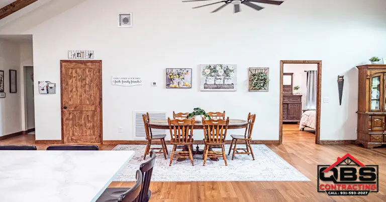 Dining area with a farmhouse table in the White Oak barndominium