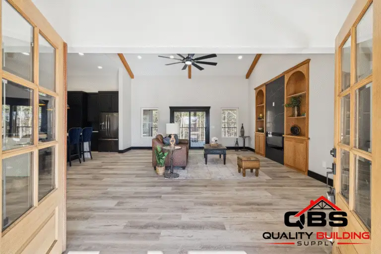 Great room with exposed beams in the Ironwood barndominium