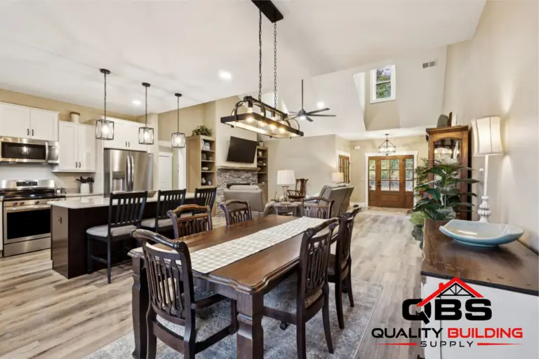 Dining area with a beam light fixture in the Oak Grove barndominium
