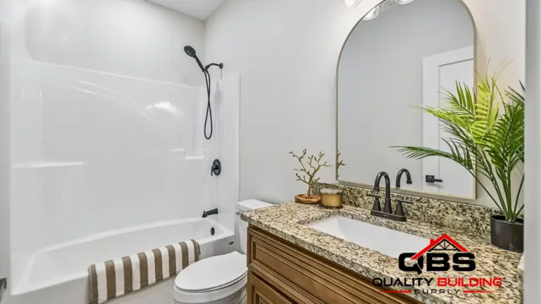 Bathroom with a tub and arched mirror in the Cobalt Combo