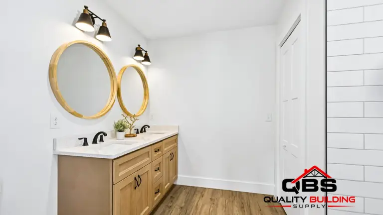 Bathroom with a round mirror in the Hillside Haven
