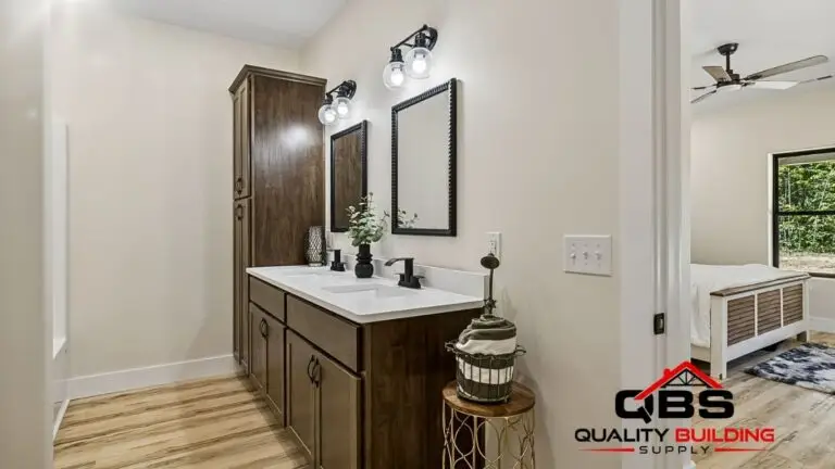 Bathroom with a dark wood vanity in the Saddlebrook barndominium