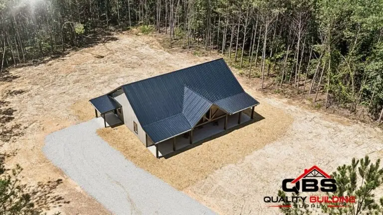 Aerial view of the Saddlebrook barndominium in a wooded lot