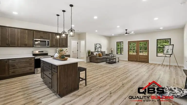 Open kitchen with a dark wood island in the Saddlebrook barndominium