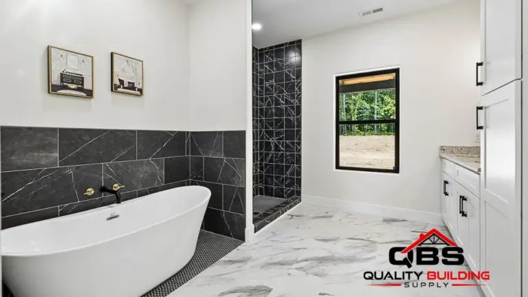 Freestanding tub and black tile shower in the Smith V2 barndominium