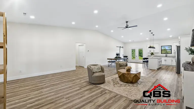 Open living room and kitchen with a vaulted ceiling in the Smith V2 barndominium