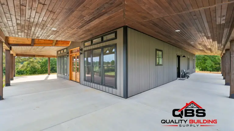 Covered porch with a wood ceiling along the Shady Grove barndominium
