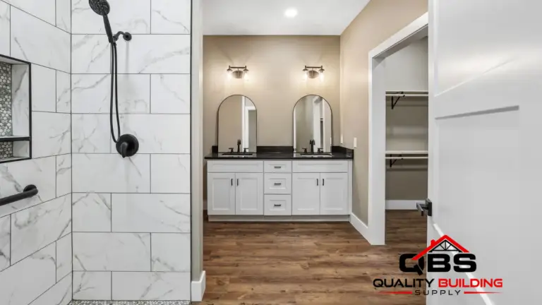 Bathroom with a double vanity and tile shower in the Shady Grove barndominium